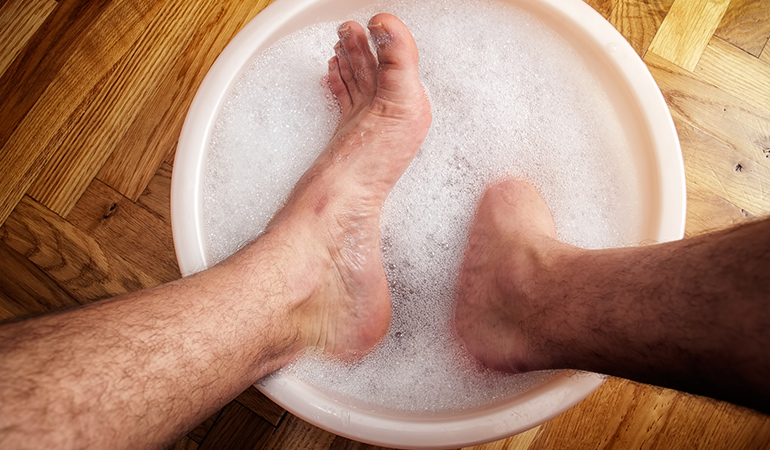Soak your feet in the vinegar for relief and aid