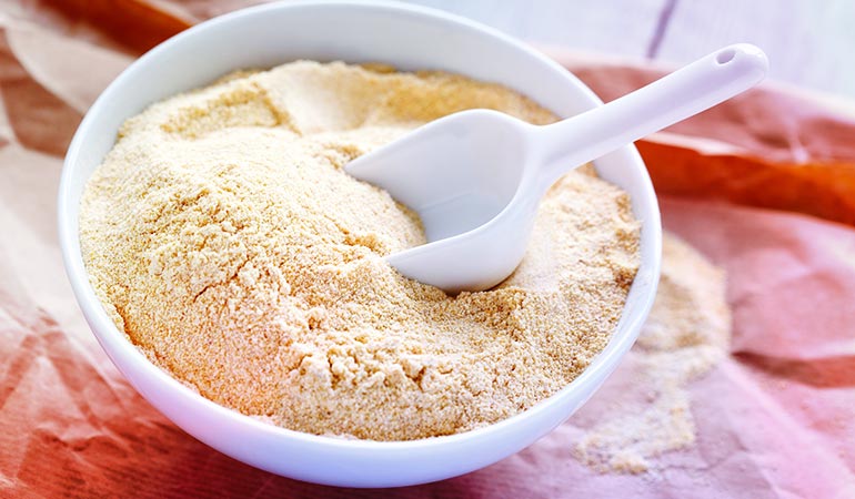Gram flour absorbs oil while milk softens the skin