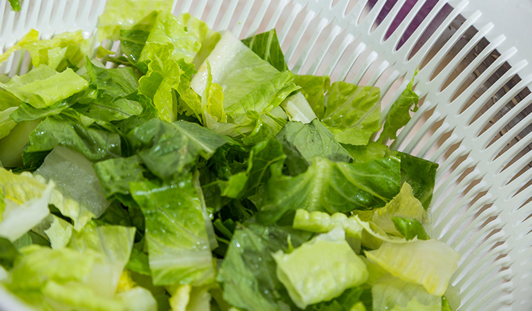 Investing in a salad spinner can help dry your veggies which in turn helps the dressing coat them better.