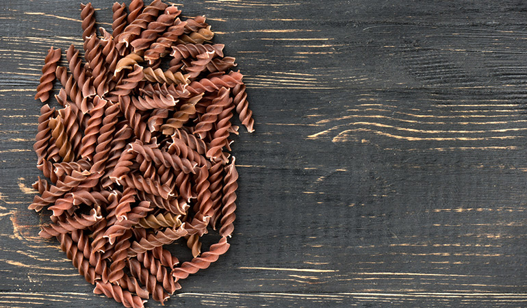 Spelt pasta is high in protein and fiber, but is not completely gluten-free.