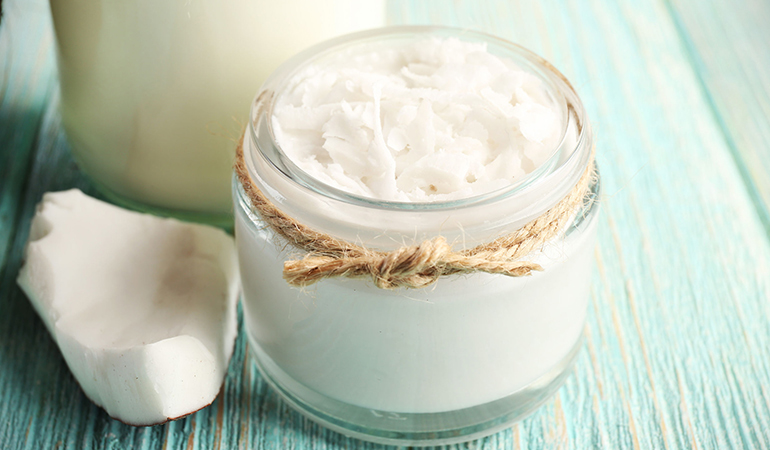 A coconut oil body butter made with solid coconut oil moisturizes dry skin, leaving it soft