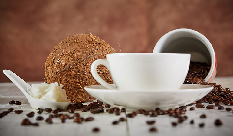 Add coconut oil to coffee or tea