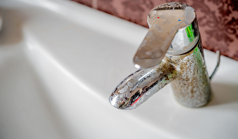 use salt to clean dirty faucets and fixtures