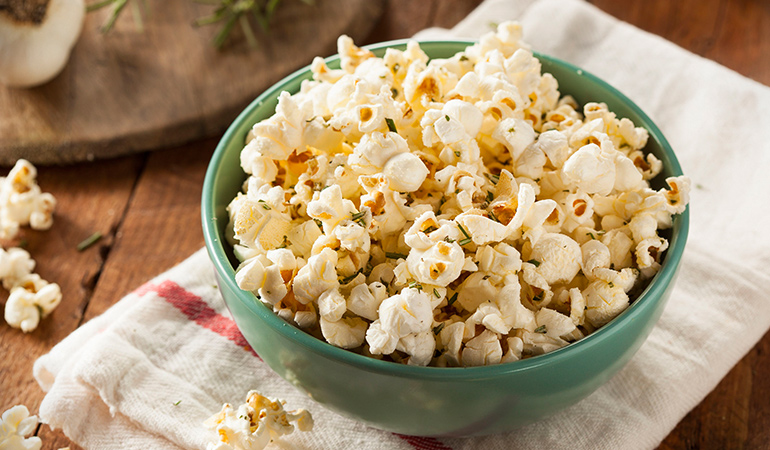 Popcorn sprinkled with some herbs and spices can make a great snack