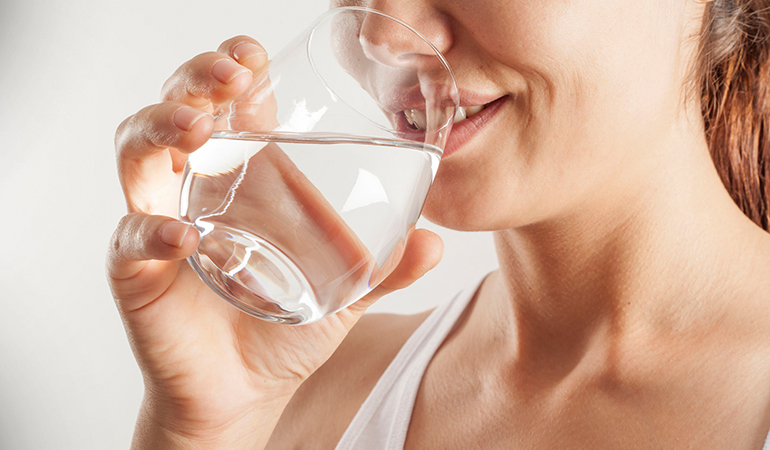 To reduce bloating during your period, drink plenty of water