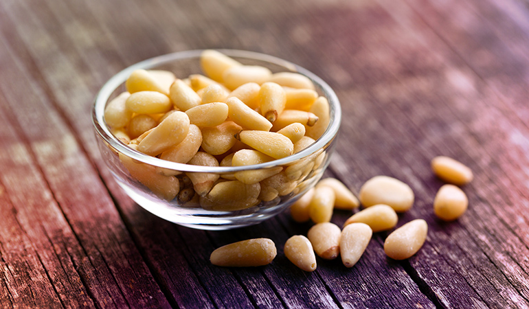 1 oz of pine nuts has 1.57 mg iron.