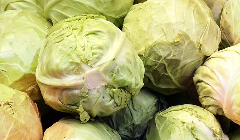 Half a cup of cooked cabbage contains 81.5 mcg of vitamin K.