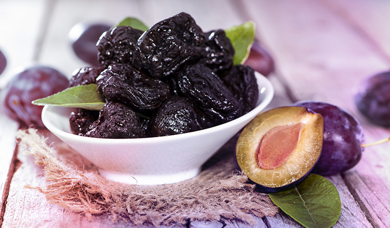 Half a cup of prunes has 103.5 mcg of vitamin K.