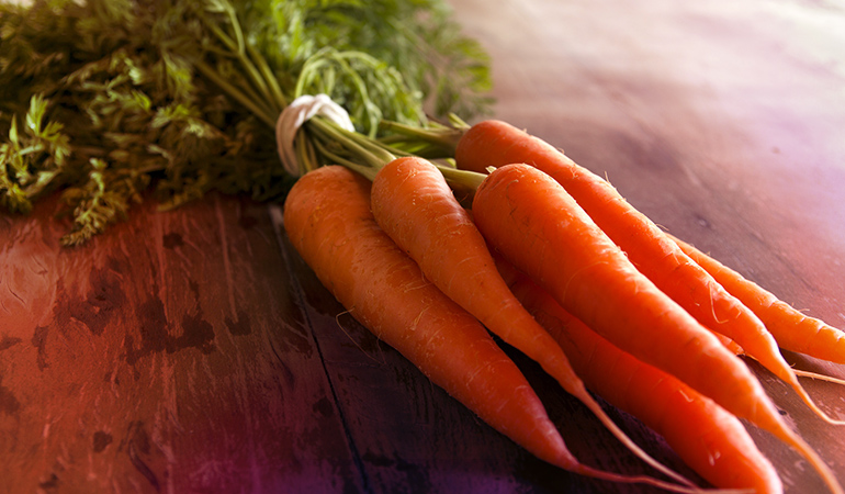 One cup of grated raw carrots has 918 mcg RAE of vitamin A. 