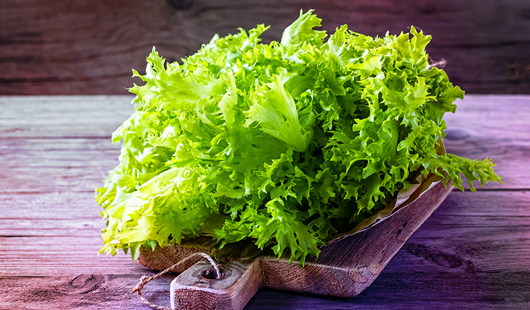 One cup of shredded lettuce has 133 mcg RAE of vitamin A. 